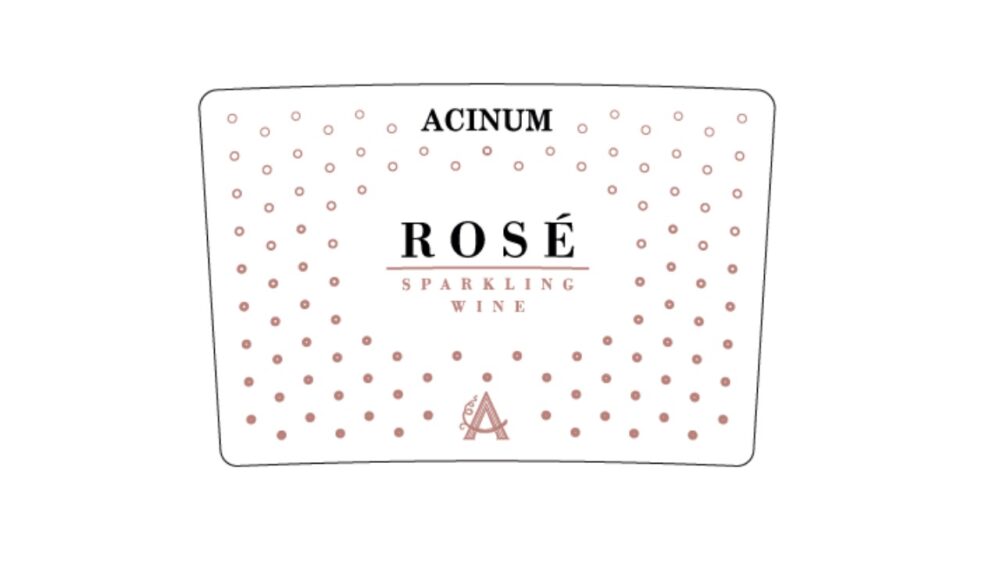 Sparkling rosé wine label with pink polka dots